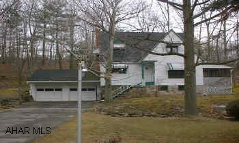 2.5 STORY CAPE COD. 3 BED., 1.5 BATH, HARDWOOD FLOORS, FIREPLACE, BUILT IN BOOKCASES SET ON APPROX. 2.5 ACRE. 2 CAR ATTACHED GARAGE. 2 PARCELS OF GROUND. LOTS OF CLOSET SPACE.