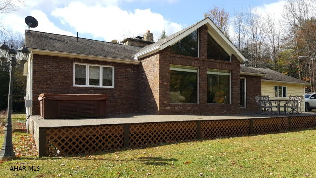 Don't miss out on this show stopping One story home tucked within 10.9 Acres of beautiful land. Enjoy watching the wildlife out of the Large windows , Sitting by the stone fireplace, Cooking in a great updated kitchen with granite counter tops or relaxing in your Master Bathroom corner tub with jets .. Tile and Hardwood throughout main floor ..  Paved private lane .. What a wonderful location for that hunter inside..Won't last long....
