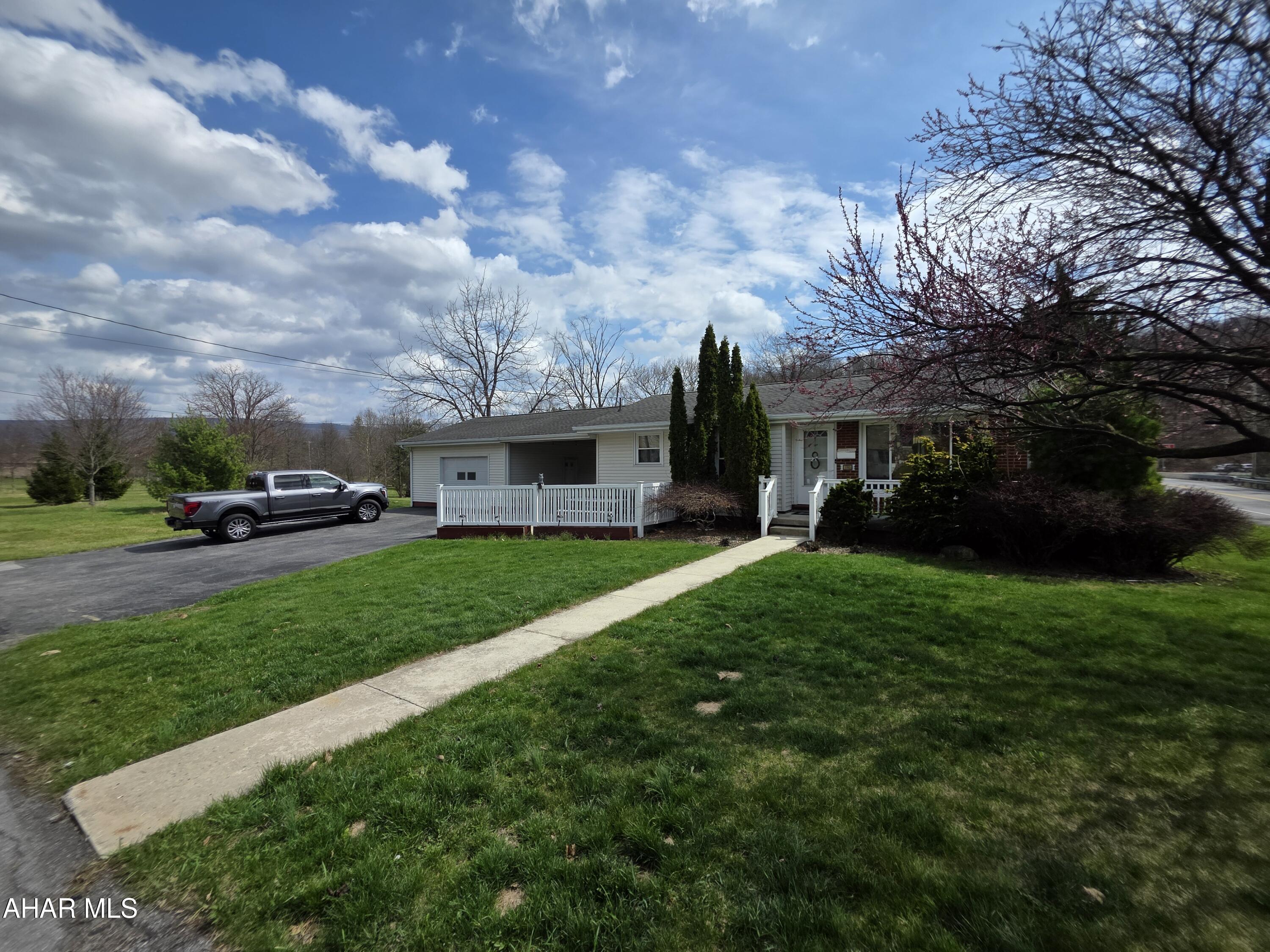 Located in a highly desirable area, this corner lot ranch offers convenient one-story living with a functional layout. The breezeway provides a versatile space to relax, unwind, or enjoy a morning coffee while staying protected from the elements, and connects directly to the one-car garage. The partially finished basement would be great for extra living space. The property also features a paved driveway and a manageable yard. Opportunity for buyers looking for low-maintenance one story living.