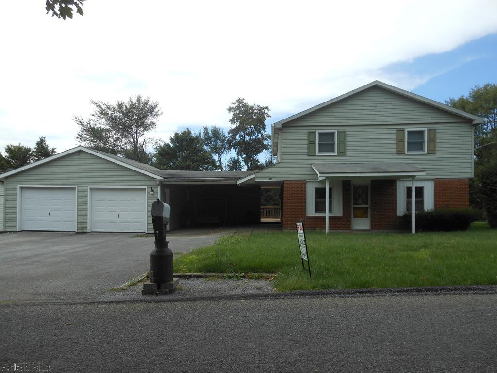 Nice well cared for house on a quiet street in Carrolltown. Large 2 car detached garage with breezeway connecting to the house. Nice open floorplan. Good flow from room to room. Main floor features a family room, living room, kitchen, dining room and laundry room with 1/2 bath. The second floor has four bedrooms and a full bath. All upstairs rooms have hardwood floors. New flooring in the dining room and kitchen. Exceptional bargain. Large 80x150 lot. Prior to setting up a showing, buyers must present a prequallification letter for a conventional loan.