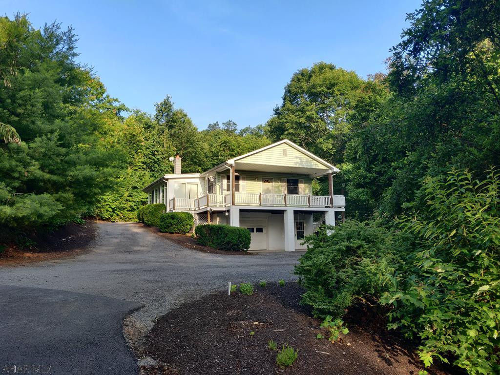 Secluded One Story Living at its Best in Rural Hollidaysburg on Wooded 5 Acre Lot. Escape to Your Private Retreat! Custom Kitchen Cabinets, Open Concept for Kitchen, Living Room, Dining Room, Master Bedroom with En Suite Bath, Basement BR and Bath. HUGE Metal Garage (28'x60') is a Dream Come True! Private Area for Camp Fires and Picnics.