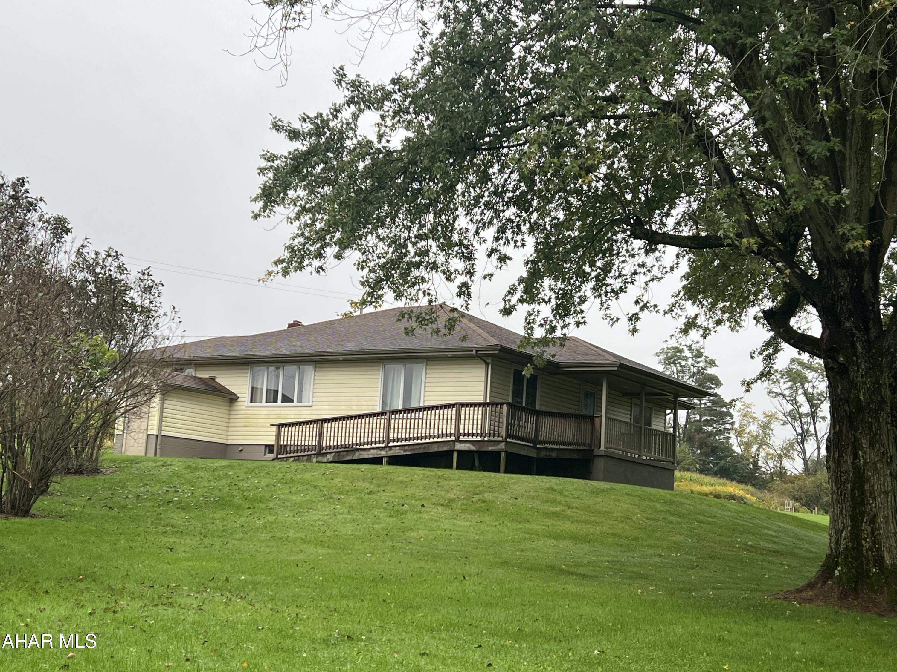 Vinyl sided ranch home on 1.1 acres. Home contains 4 bedrooms, kitchen, living room, dining room and 2 baths. Full unfinished basement. Detached two car garage.  Shared driveway.