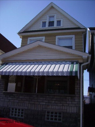 Meticulously maintained 2 story - great mechanics - newer roof, furnace, hotwater tank, range, new carpet throughout, block 2 car garage, landscaped yard, first floor laundry - Move right in!! New windows - spouting, updated ext. doors, air lock porch at side entry, basement windows glass blocks sold as is.