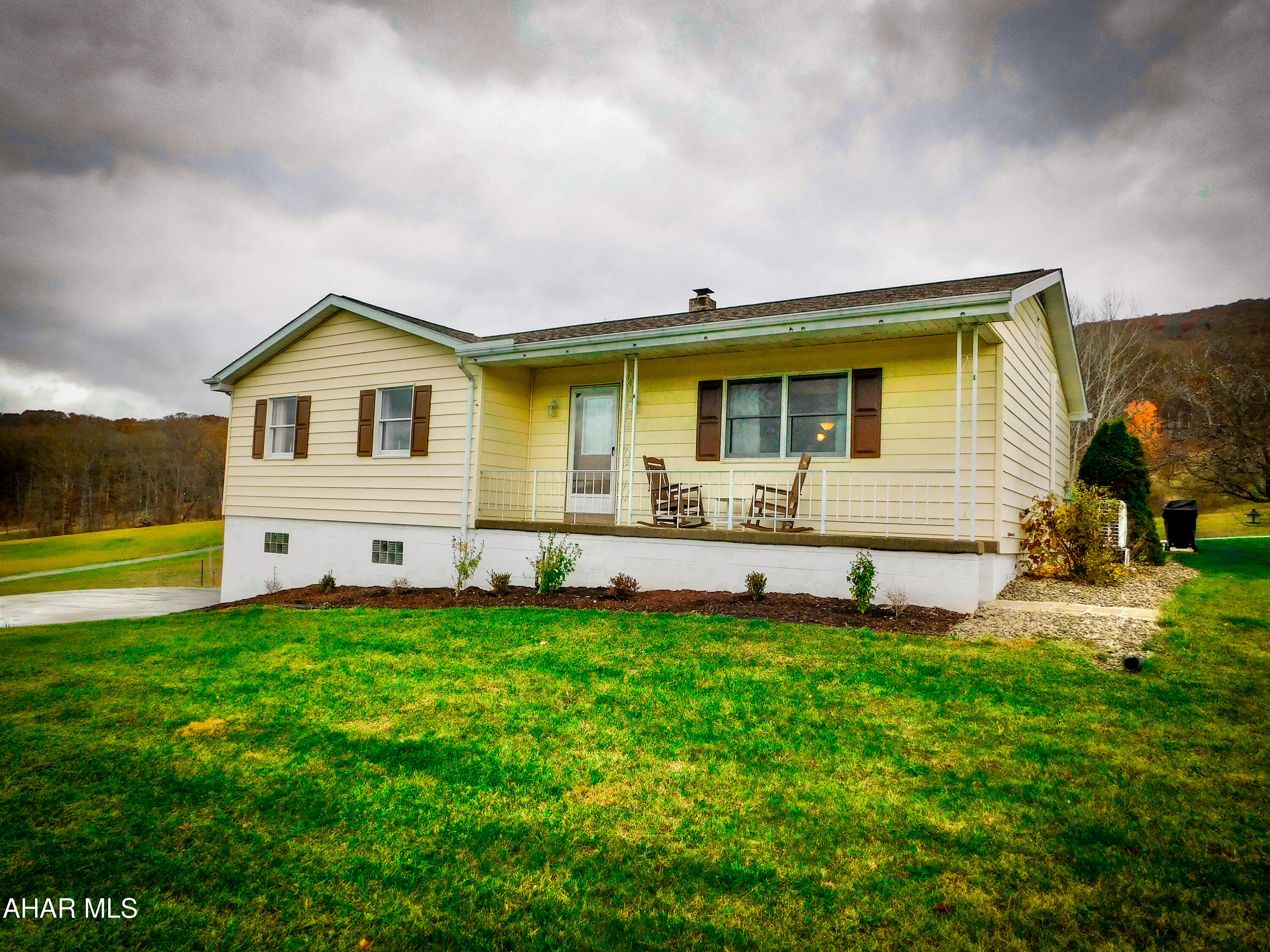This 1 story home sits on almost a full acre &offers exceptional views as it sits at the top of this winding road. But wait!!!theres an additional acre included!!
Brand new roof and updated kitchen (tile backsplash & Corian countertops) & Baths as well as new flooring make this a perfect scenario for any home buyer. Country views and plenty fo elbow room to grow. 
Finished room in lower level w/ 3/4 bath.  2 C garage & Good storage and dont miss the large rear sunporch and wrap through driveway.