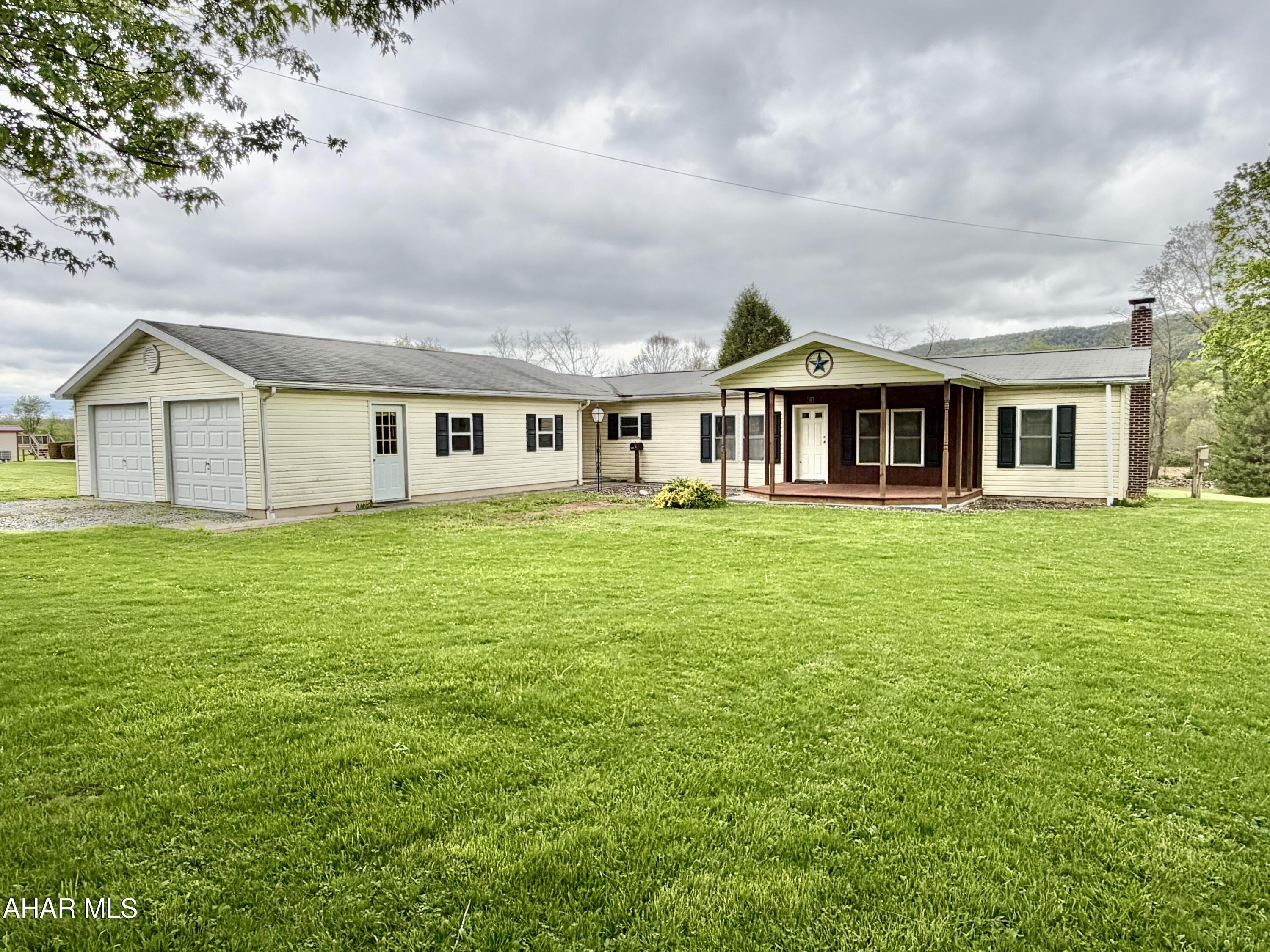 Manufactured home located just outside of town in scenic Snake Spring Valley. This property features 3 bedrooms, 2 baths, a living room, dining room, family room, laundry room, and a full basement. Outside, you will find covered front and rear porches, a 24'x32' garage, carport/patio area, workshop, and a large yard. A great opportunity for those looking for country living with convenient access to town.