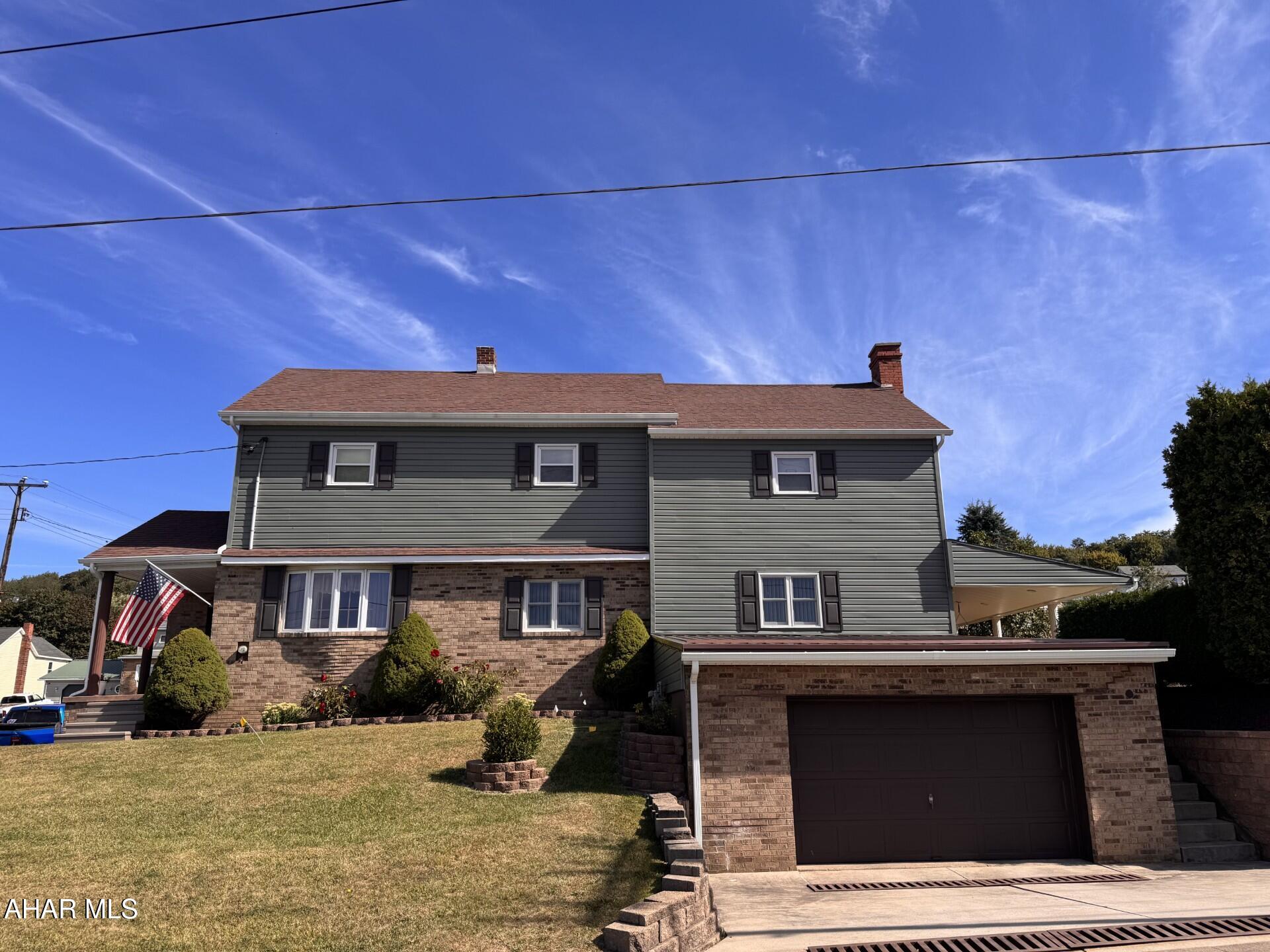 2 story vinyl & brick home on corner lot.  Spacious eat-in kitchen with bar & table area, LR with propane fireplace, DR, first floor laundry, 3 large bedrooms. Covered side porch for entertaining. 1 car attached garage.