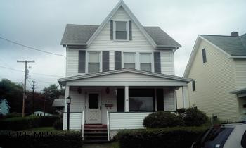 Lovely 2 1/2 story on a corner lot with a 2 car detached garage maintenance free exterior-- very well insulated, newer windows- very low gas bills. interior needs some TLC- priced to sell---finished attic could be 3rd bedroom