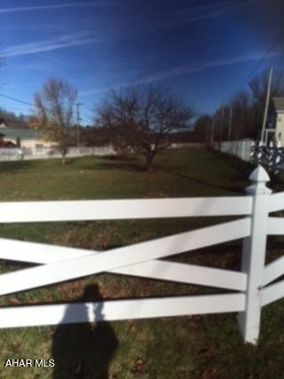Half acre level lot. Completely fenced. City water and sewer available.