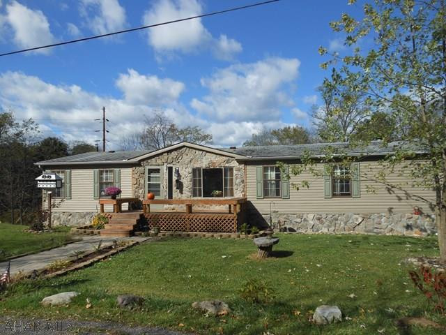 Nice country setting but close to town. Double wide featuring large living room, family room with fireplace, equipped kitchen, master bedroom with full bath off, partially finished basement with integral two car garage. Nice storage shed included.