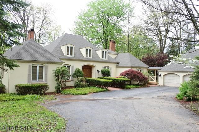 Stately home in a scenic, convenient location....only minutes to the stores, schools and 99 access. 4 Bedrooms...possible office on the first floor and a Family Room on  this level PLUS one on the lower level....AND a wine cellar.  First floor layout is perfect for entertaining....LR has tall, bright windows with views of the fenced, wooded lot...Dining Room has spacious built-ins and French Doors out to a Sunroom and Brick Patio...There is a spiral staircase to the upper addition that features a Hot Tub, FP and entertainment area.  The Owners' Suite is the entire 2nd floor...ton's of storage, recessed lights, built-in media shelving and access to the Hot Tub and First Floor Sun Room.  Beautiful, private, .84 acre lot....3 car garage....doesn't get any better than this location.
