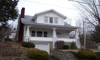2 story stome and vinyl house close to town Well kept home with oak kitchen, fireplace and open oak stair way. first floor laundry and 2 car detached garage and one car integral.