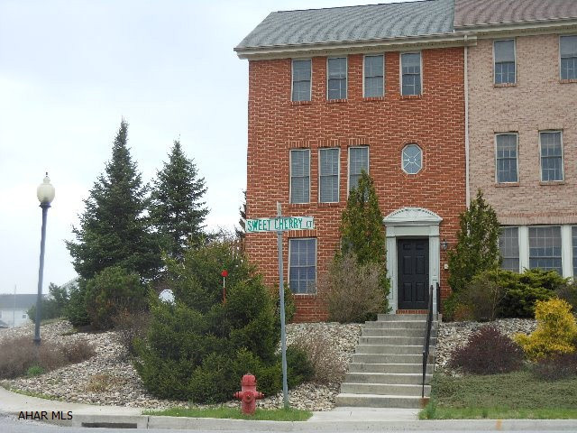 Terrific end unit Townhouse with fenced yard area and private deck. Bright and cheery with additional windows because of being an end unit.  Upgraded ceramic floors,ceiling fans, window blinds throughout entire townhouse,new basement toilet & freshly painted.  Large finished Family Room on lower level and 1/2 bath  Enjoy the open spaces and playgrounds of Holliday Hills Developement.