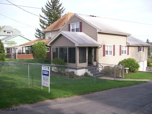 Cape Cod. Move right in. Maintenance free. Corner fenced in yard. 3 season room. Newer windows. Modern kitchen & baths.