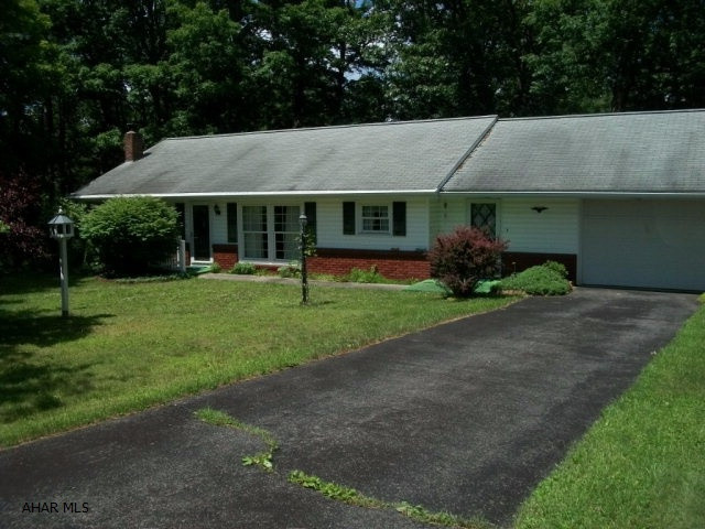 Well maintained ranch house minutes from Everett, Interstate 70, Pa turnpike, and 30/Lincoln Highway.  The property includes mature foliage, perennial flowers, covered large patio, and brick flower boxes.  The home has large new windows with custom draperies in front of home the brings in natural light and beautiful view of front yard.  The living area has an open concept and feel. There are 3 bedrooms, 1 full bath with basement plumbing for a second full bath. The breezeway between the garage and home is a peaceful resting place, reading spot or could be a great play room.  Lots of potential with this well maintained home.