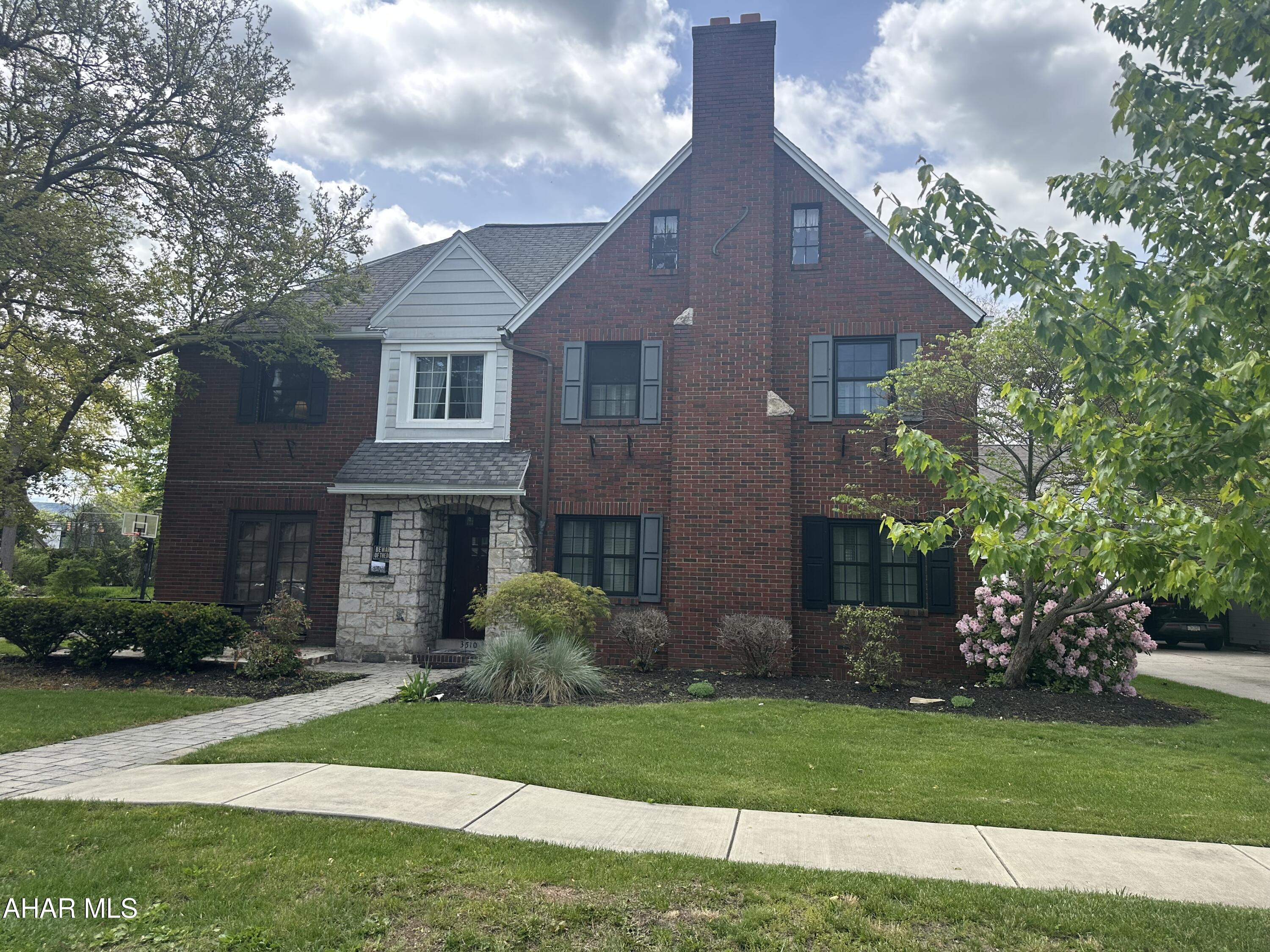 Charming Mansion Park brick & stone home with so much character.  Four bedrooms, two and a half baths. Spacious living room with a gas fireplace and cove trim throughout. Large formal dining room perfect for entertaining. A first floor den that has wood lined walls with custom  bookshelves and an enclosed bar cabinet.  First floor laundry. The eat-in kitchen leads out to a nice patio area. Spacious flat back yard. The second floor bedrooms are all large and offer ample closet space. The third floor bedroom is large with storage space and 3/4 bath. Almost all of the windows in the home have been replaced with a warranty transferrable to the new buyer. This one will not last...call today to see this beautiful home!