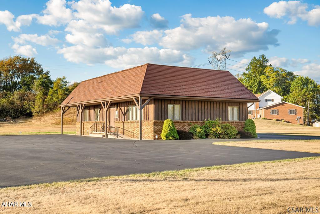 About 1600 sq. ft. of prime office space is available now in the Jackson Township area! This well-kept building includes a reception area, a roomy waiting room, a kitchen, several private offices, and a clean, dry basement great for storing inventory or files. A newly installed well ensures an independent water supply, and the parking lot easily fits up to 25 vehicles. Elevate your business with this solid and versatile space! If you're looking to expand, additional acreage is available. The property also has the potential to be rezoned for residential use.