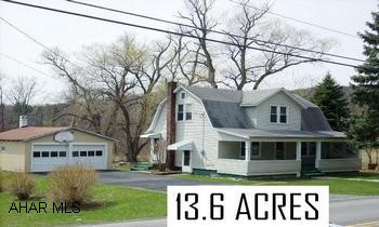 EXCEPTIONAL OPPORTUNITY--13.6 ACRES OF GROUND.  INCLUDES 2 STORY 3 BEDROOM HOME (NEEDS SOME RENOVATION) INCREDIBLE SETTING.  BELLWOOD SCHOOLS