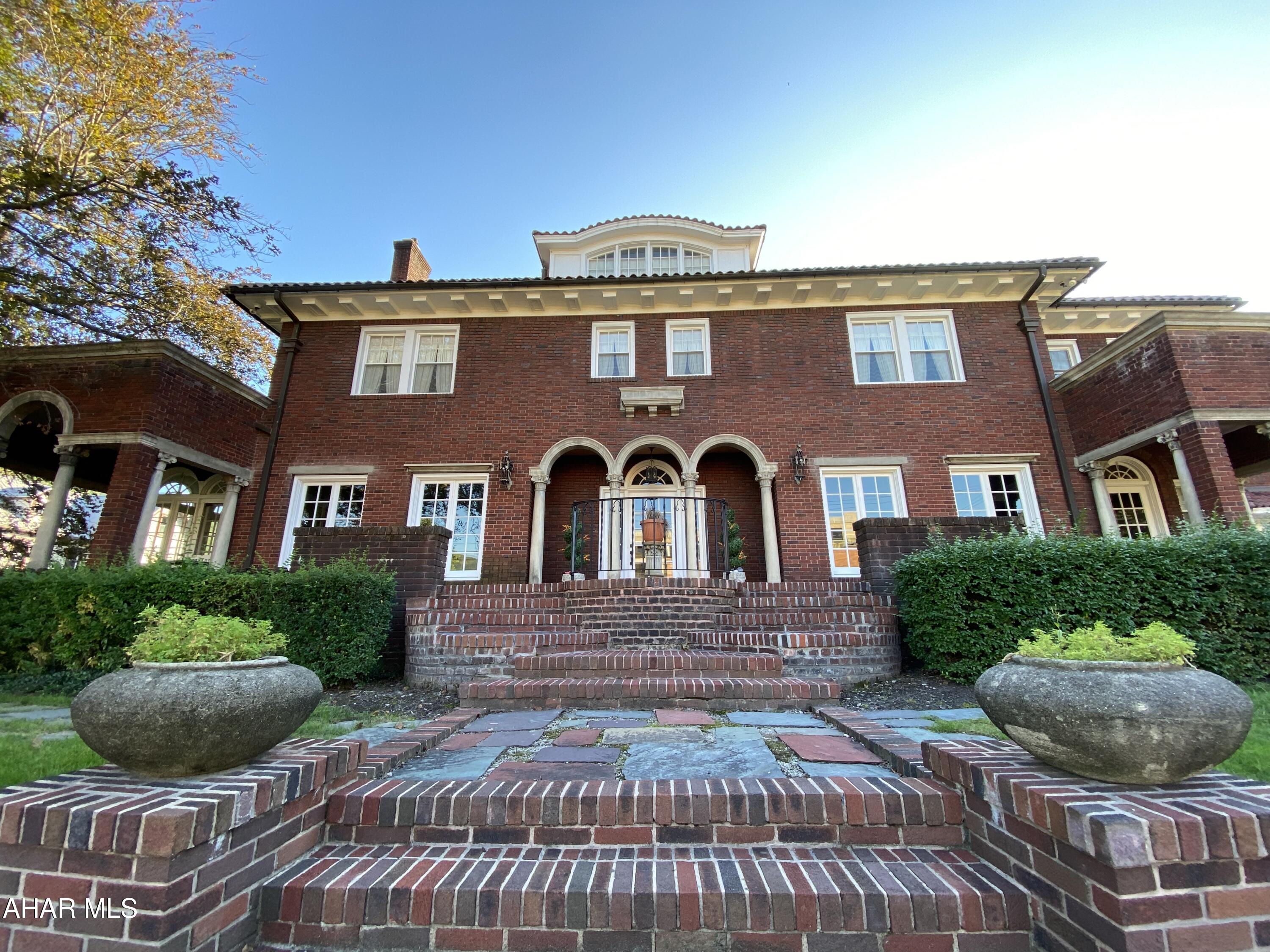 Historic Bed and Breakfast in Tyrone, PA

Stunning 5-bedroom, 4-bathroom mansion built in 1928 that reflects Spanish Colonial and Mediterranean Revival styles. Currently run as a bed and breakfast, the mansion features a library, sunroom, formal dining room, central air, intercoms, and modern amenities like WiFi and smart TVs. Prime location between State College and Altoona. Close to Penn State events, Altoona attractions, and outdoor activities at Spruce Creek and Raystown Lake. Perfect for themed packages and vibrant community events. Contact us today!