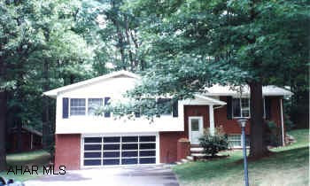 EXCEPTIONAL BI-LEVEL ON LARGE WOODED LOT. MODERN KITCHEN WITH PERGO FLOORS. 1ST FLOOR FAMILY ROOM, PLUS FINISHED BASEMENT WITH FIREPLACE.