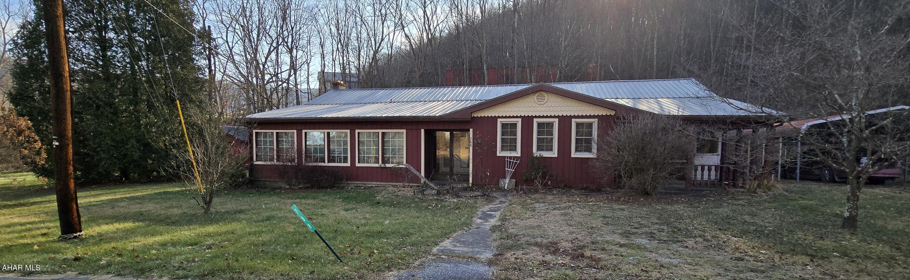 Country charm with tons of character. This 4 bedroom home is located just minutes from the Raystown branch of The Juniata River and about 25 minutes to Raystown Lake.  Bring your imagination to finish the immense dream kitchen the former owners framed out behind french doors of the large great room.  This home offers so much space inside in out, with additional land  across the street with a large shed.  Call me today for your showing!