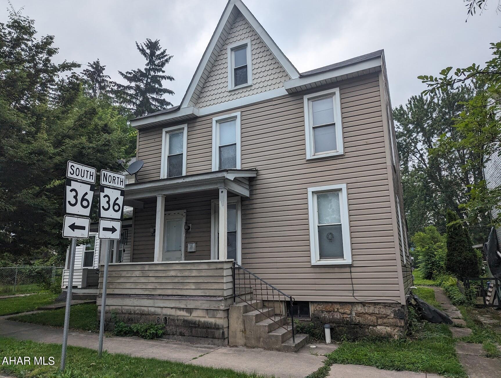 Hollidaysburg Borough single-family home with three bedrooms, a nice yard, and ample off-street parking.