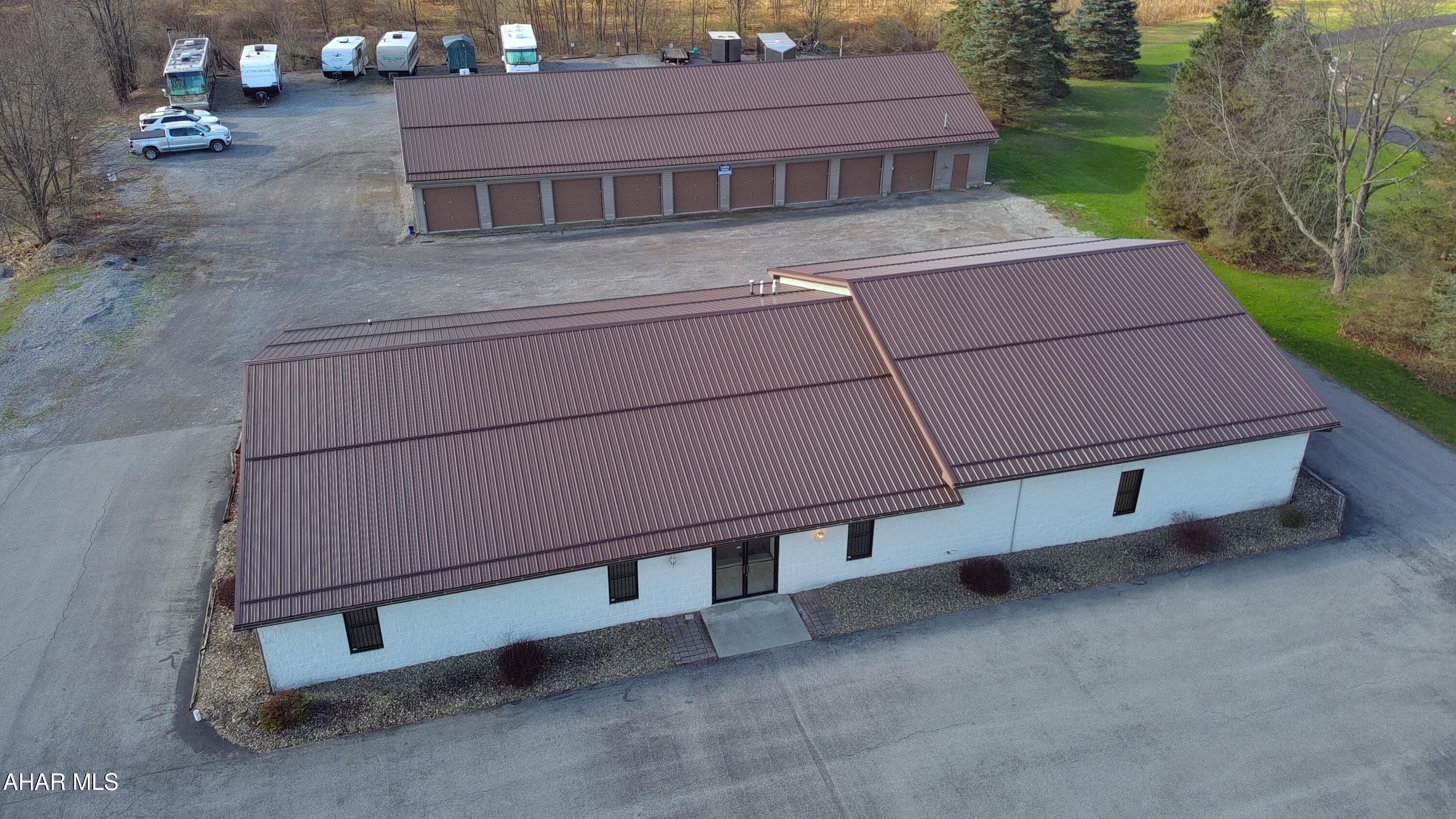 Unlock a multi-stream revenue powerhouse in the heart of a high-traffic corridor! This 1.66-acre property offers the perfect blend of owner-user potential and passive income stability. The property is situated in a high-visibility area ensuring constant ''free'' marketing with heavy daily traffic counts giving endless potential to this solid 5000 sq foot block building.  Ideal for retail, light manufacturing, or even a flagship corporate office as there is plenty of parking to accommodate guests/clients. The storage units are currently fully occupied with the exception of the large 4 unit garage that was used by current owner. The year round RV parking offers additional monthly income.  A new metal roof was installed on both buildings in 2021 giving you long term peace of mind. With 1.66 acres there is plenty of room to expand. Located in the center of action your business will be seen and tenants will have easy access. Whether you are looking to move your business to a high-profile location or seeking a stabilized asset with diverse income streams, this property delivers!  Call today for details!