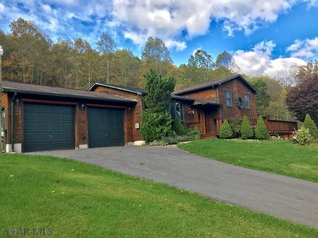 Secluded 31+/- acres conveniently located between historic Bedford and Cumberland, Maryland. This is the perfect hunters and nature lover's paradise. Wildlife is abundant because the property borders Evitts Creek and is within minutes of state game lands. Cedar siding enhances the natural setting which blends seamlessly between outdoor and interior spaces. French doors, large bay window, walk out basement, double car garage, master suite and central air are some of the home's wonderful attributes. A large 24 X 48' pole buildings provide lots of storage. One must see this property to appreciate.