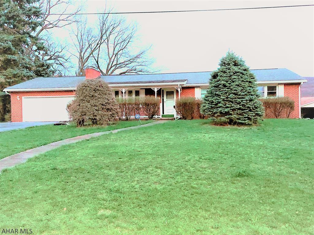 Welcome to this fantastic, well maintained 1 story brick home with a large basement in the heart of Hileman Heights. Brick exterior is maintenance free. W/4 BRs, large kitchen and living room with gas fireplace (converted from wood burning) and a large backyard with 3 buildings perfect for man-cave, she-shed and storage. Attached 2 car garage, gas water heat and central air conditioning. Basement, which is another 1600sq ft, includes kitchenette, laundry area, recreation room w/fireplace, workshop and powder room with shower. Your next home is central to shopping, schools, healthcare, and just minutes from I99. This is a great opportunity to live in a quiet neighborhood with a view of the mountain in your backyard.