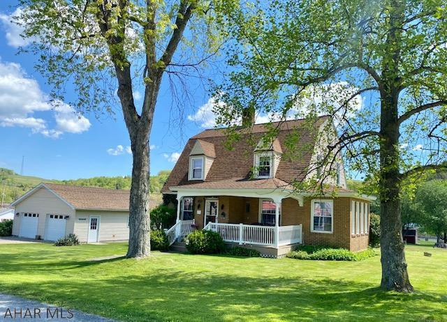 Charming country 2 story brick located 29 miles from Altoona.  Lots of house for $149,900 plus integral garage and attached garage and L shaped deck.  Updated kitchen including hickory cabinetry, corian counters & all appliances.  First floor Bonus Room could be 4th bedroom.  Heated sun room off the living room.  Under carpeting in living room & flooring in dining room is 1929 hardwood floors.  Great location, very well maintained house.