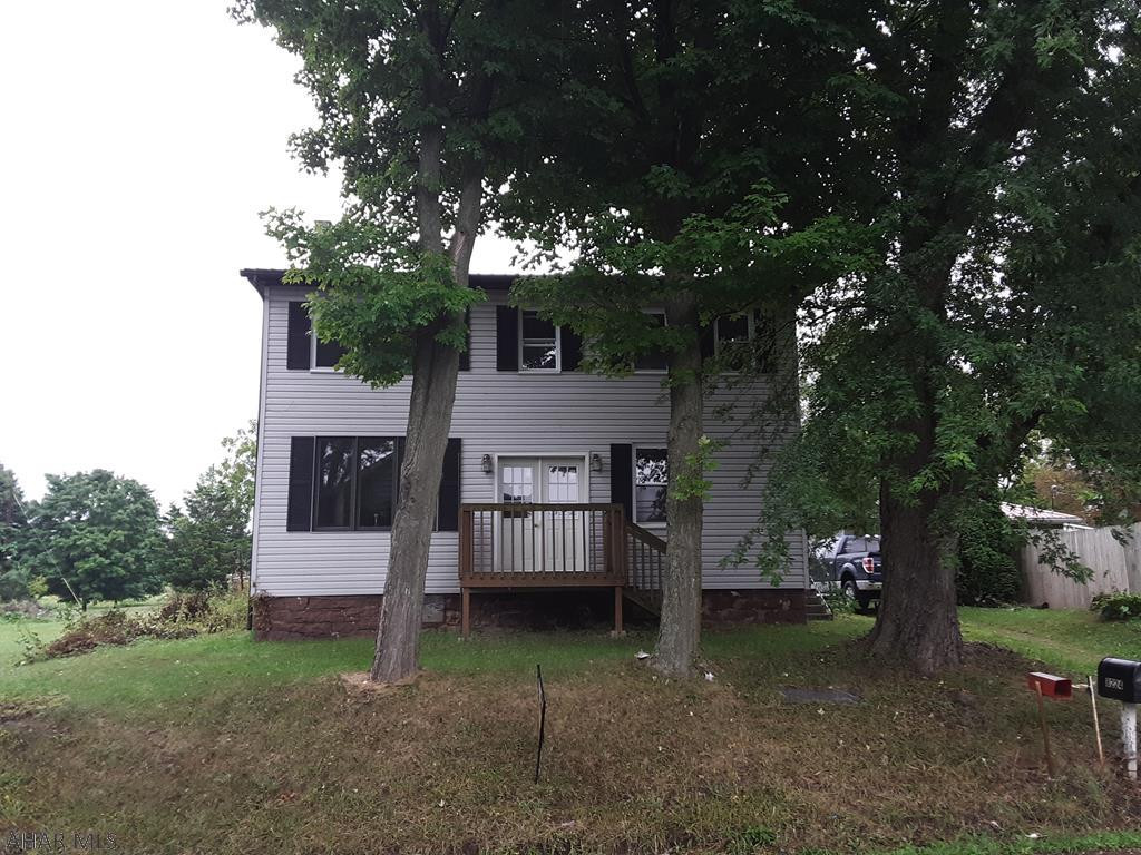FIXER UPPER!!!   Priced to SELL!  This fixer upper has good sized rooms and a large, partially fenced, level yard.  Bonus rooms which give you lots of options to design this home the way you want.  Two car garage, long enough to fit 2 vehicles, or 1 car and a big workshop!  But wait, there's more!  Another whole building - Clearville's original country store is a separate lot with this property.  Imagine - Two for the price of one! With some sweat equity, you could have your own business.  Could this become full time living?  Something to think about if you have loved ones you need to keep close, who still want their independence.  At this price, you can't go wrong!