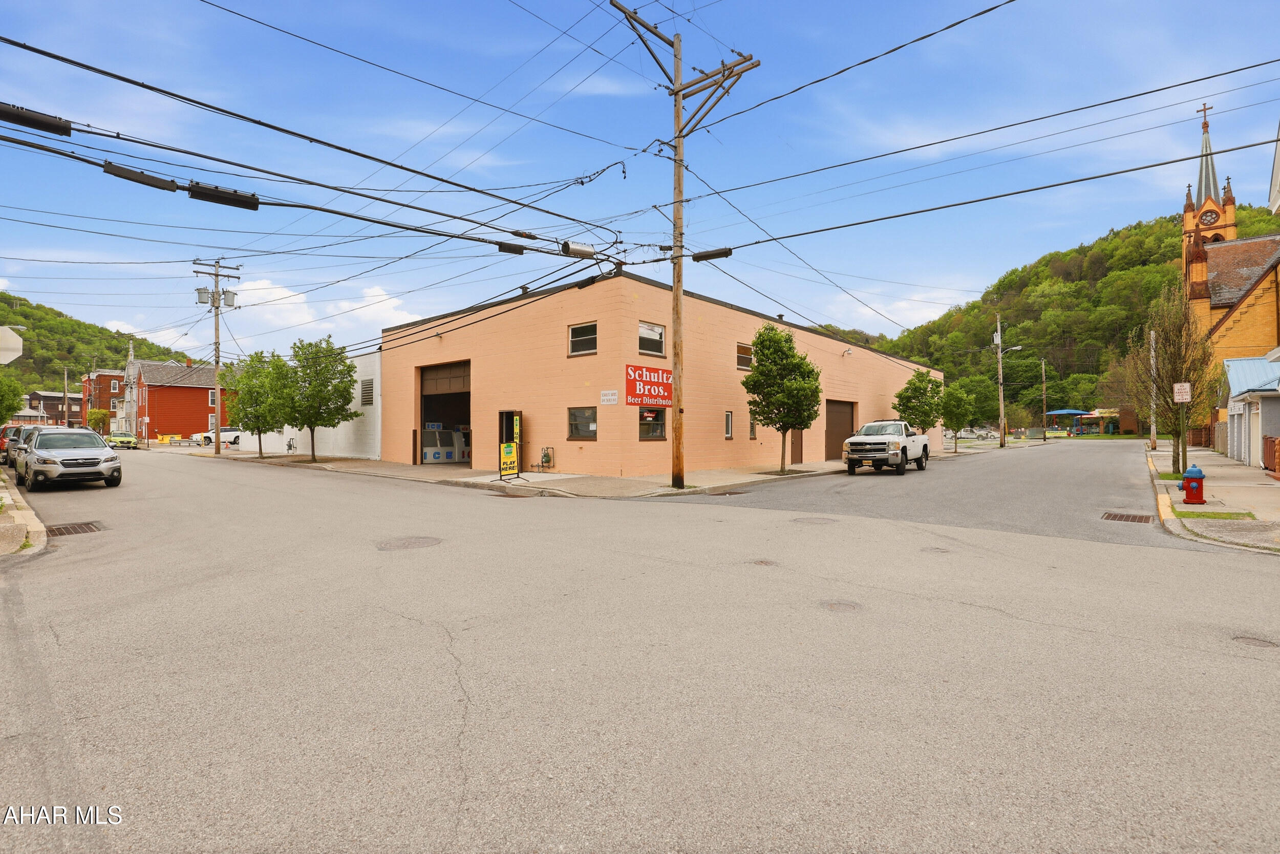 Own a piece of Johnstown history with this turn-key acquisition of the Schultz Brothers Beer Distributor, a community staple for over 50 years. This comprehensive sale includes the well-established business, a loyal client base, and a highly sought-after PLCB 'D' (Distributor) liquor license. The versatile 5,700+ sq. ft. facility features a massive heated warehouse equipped with two extra-tall garage doors, a high-capacity walk-in cooler, and additional finished space comprising a professional office, two bathrooms, and a versatile second-floor loft. To ensure a seamless transition, the purchase includes essential operational assets such as a delivery van, a beverage/keg trailer, a forklift, and office supplies. Strategically located just one block off Broad Street, this property offers incredible visibility and potential for a variety of industrial or retail ventures. This is a rare opportunity to step into a fully-equipped, profitable enterprise in a prime commercial location.