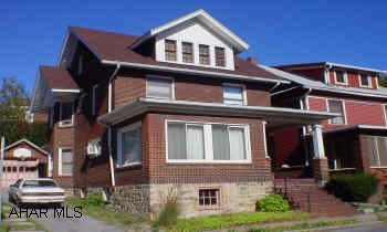 Spacious 2 1/2 Story Brick home with 5 bedrooms. Beautiful oak trim throughout, detached garage. A must see!