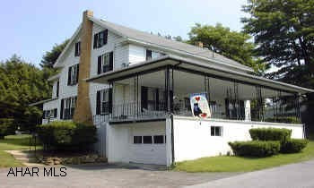 Double house - Apt 1 =3b/r+ w/ 2 car integ. garage & lg. shed.  Apt 2=2 b/r with basement.  Lg. cvd front porches & enclosed back porches. Apt 1 owner-occupied.  3 b/r + 2 addl in attic.  3/4 bath in basement.  Sep util.  Est. rent 450+ util.Apt 2 rented.  2 b/r, kit, d/r, l/r, bsmt - 325 + util.