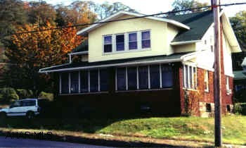 Nice Brick & Vinyl Sided 2 Sty,  Repl.Wind. on 2nd Flr. Fireplace, enclosed & heated Sunporch. Rooms are good sized. Brick 1 car gar.  "AS IS".
