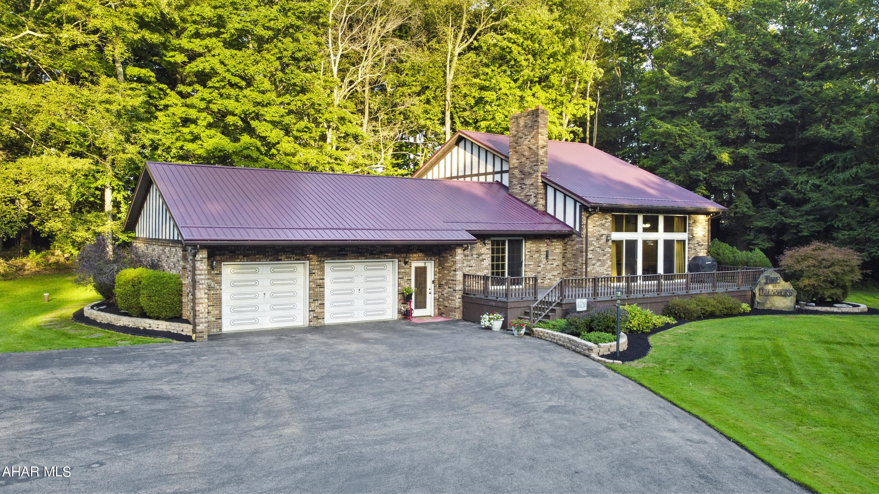 Welcome to your dream oasis of comfort & convenience, located at 116 Logan Lane in the highly sought-after Central Cambria School District. This stunning multi-level home is beautifully nestled on a tranquil 7.3-acre lot, showcasing meticulous attention to detail throughout. As you step into the main floor, you'll be welcomed by a spacious tiled foyer that opens to an expansive living room featuring soaring cathedral ceilings, plush new carpeting, & a cozy propane fireplace. The kitchen has been tastefully updated w/ brand-new appliances, luxurious vinyl flooring, & custom granite countertops. The main floor also boasts three generously sized bedrooms, two full bathrooms, a convenient laundry room, a dining area ideal for entertaining, & a versatile bonus space that invites relaxation & gatherings. Venture upstairs to discover an office, an additional bedroom, & the master suite, which offers a lavish en-suite bathroom & an impressive walk-in closet designed for all your storage needs. The unfinished basement has been thoughtfully framed & is ready for your finishing touches. Additional highlights of this remarkable home include a newer furnace & hot water tank. Finally, you'll find an attached two-car heated garage w/ overhead storage, a spacious detached garage measuring 25x35 w/ electric, & ample space for a potential pond w/ a dock. Enjoy the beauty of nature w/ walking paths, lush blackberry bushes, & a large entertaining deck—all while basking in the privacy that this property provides. Don't miss the opportunity to make this exquisite haven your own! Call today for more information and to schedule a private tour!