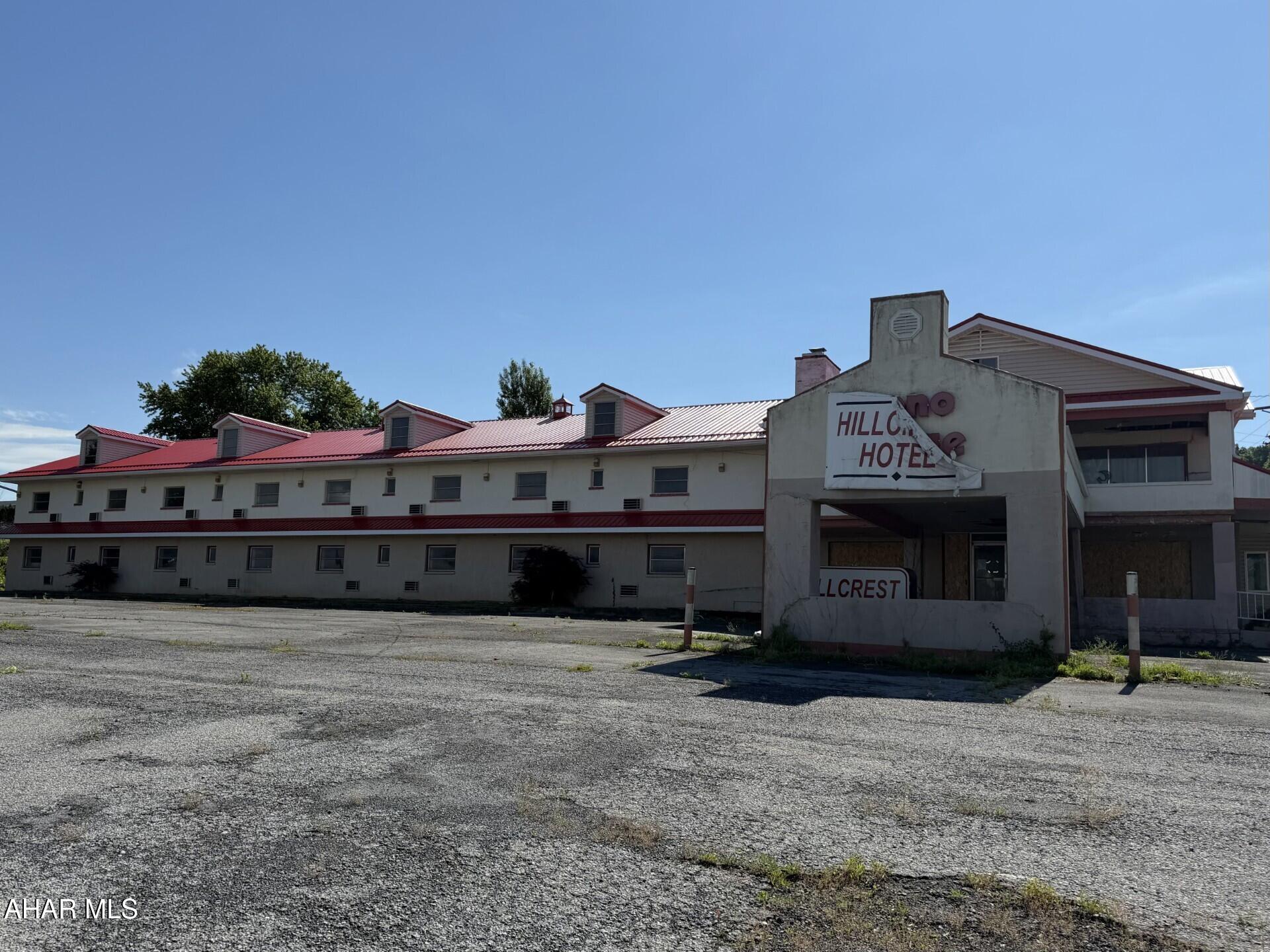 Great location !  Commercial building - Was previously a 32 unit motel.  No utilities on in building. Needs some reconstruction. A lot of possibilities in this no- zoning township. Call today!
