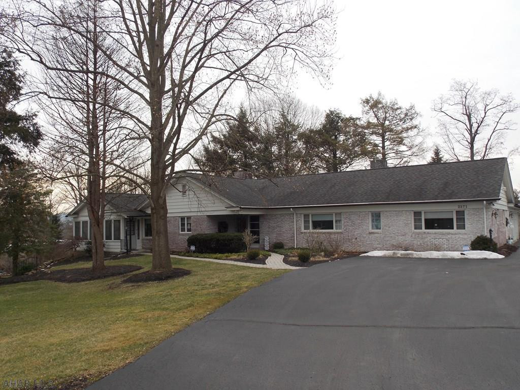 Beautiful ranch home in a very desirable location in Hollidaysburg.  Nothing left to do in this home because it has already been done.  Gorgeous new kitchen and 3 and a half new baths.  All but the half bath have radiant heat floors.  The Great Room/DR combination has a wood burning FP and tons of windows that give so much light. The sunroom is heated and adds extra space for entertaining because it leads to the new deck with beautiful views.  There is a 3 car garage and the driveway has both an entrance and exit and will hold many cars when you have visitors.  If you are a golfer walk right over to the Blairmont for golf a swim or dinner.  This home is on a crawl space and does have storage in the attic with pull down stairs.  So much to offer and a .93 ac. lot.  Give us a call today!
