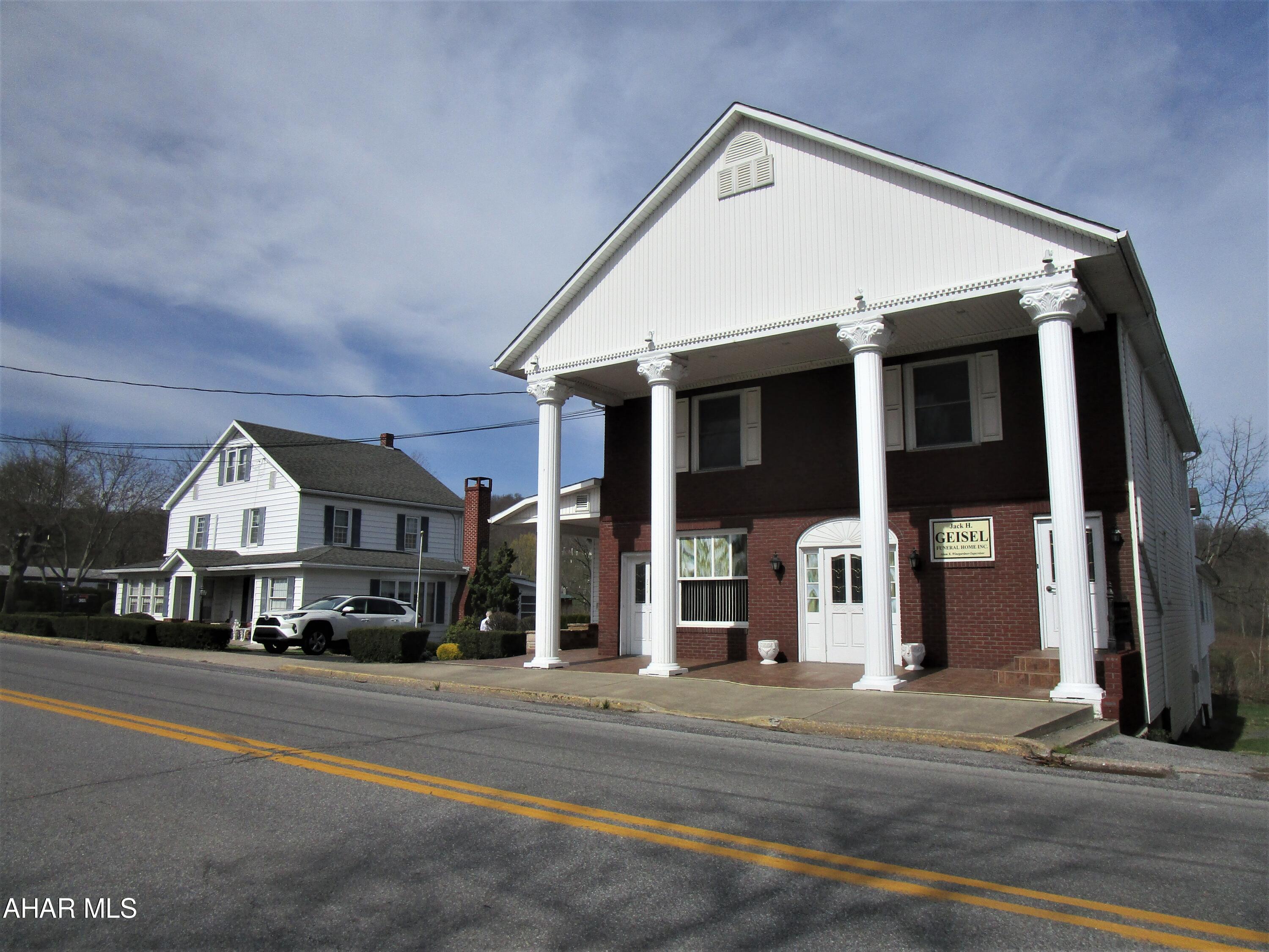-EXCELLENT INCOME OPPORTUNITY:  
Funeral home w/ 4 apt's. on 2nd & 3rd flrs. + basement garages + nice, 2-sty. single-family house + 0.602+-acre site with abundant on-site, paved parking for 40+-cars. Public water & public sewer.  ''CONVERT MAIN LEVEL OF FUNERAL HOME INTO ADDITIONAL APARTMENTS! 

INCLUDES:
2.5-Story, 1900-built, funeral home with 4 nice apartments + basement garages with a 5+-vehicle capacity. 

AND, 

Single-family house - 2.5 story era 1885+- with additions, 3 BR, 1.5 baths, quality-finish kitchen with built-ins, formal rms., fam, rm., fireplace, porch, deck,,... ;

And, 

-0.602+-Acre Site:  Spacious, paved parking lot with 2 paved driveway accesses; capacity for 40+ cars. Acccess  along east side of funeral home to basement garages (2 overhead doors).

-There may be 3+-wells on the property;  statuses are unknown, e.g., if still there, locations, depths,....

-Sq. feet of building areas; site areas; taxes; borough & township ordinances/etc.; &, how utilities are split/set up' are  to be confirmed by Buyer; NO warranties are implied by the participating real estate agents & their realty offices.