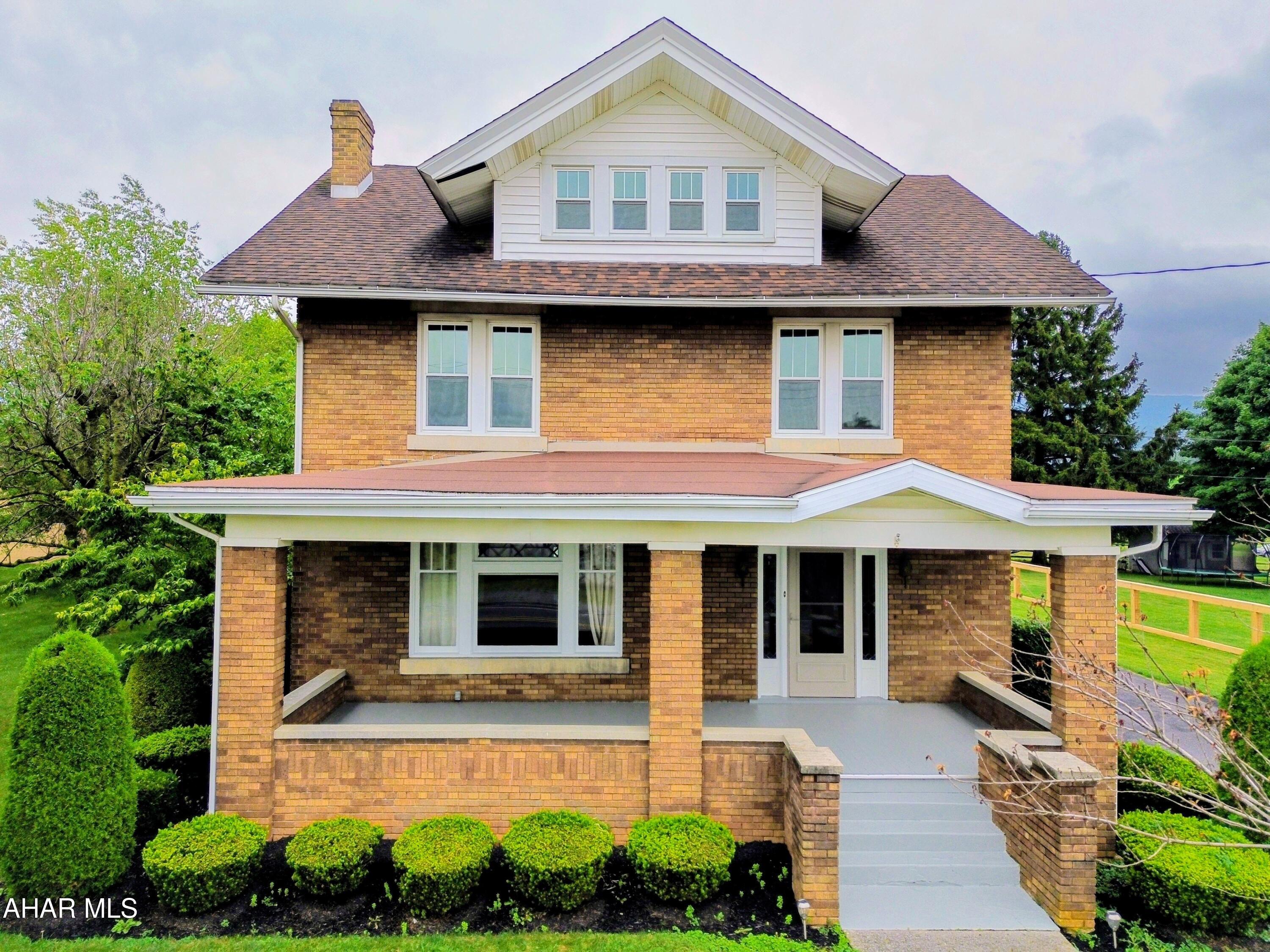 Opportunities like this don't come along often! This unique property offers the perfect combination of timeless charm, generous living space, and exceptional versatility. Situated on 1.216 acres with a spacious yard, the stately two-story brick home features five bedrooms, two full baths, beautiful hardwood floors, gorgeous original trim work, stunning built-ins, and touches of stained glass that add character and warmth throughout. Newer windows and a newer roof provide added peace of mind, while the gas fireplace creates a cozy gathering space.

The standout feature is the impressive commercial concrete block garage/building offering five oversized bays, multiple workshop areas, and dedicated office space--ideal for a business owner, contractor, hobbyist, collector, or anyone needing substantial workspace and storage.

Whether you're looking for a beautiful place to call home, room to grow your business, or both, this one-of-a-kind property offers endless possibilities. Schedule your showing today and discover everything this exceptional property has to offer!