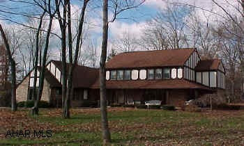 Wonderful home! Gorgeous family room with wood Cathedral ceiling and unique fireplace. Lots of windows, lovely lot. Solid oak doors & trim.