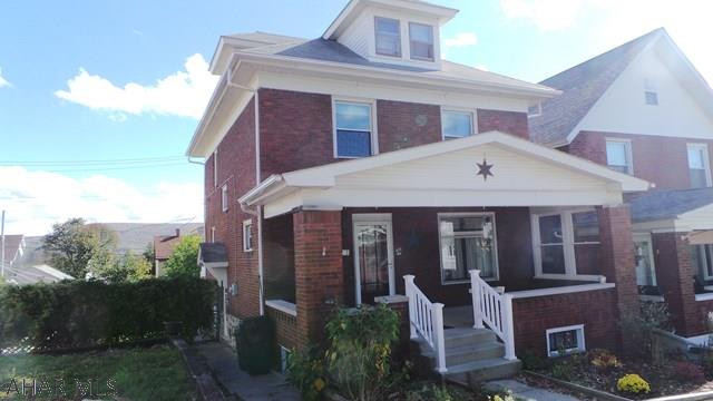 Nice brick home with hardwood floors, original woodwork, finished and heated 3rd floor for 4th bedroom, double lot.