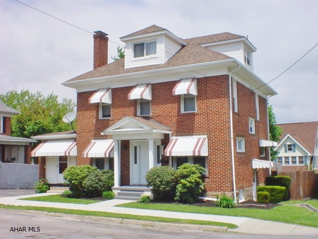 Motivated Sellers! Fantastic corner brick 3 bedroom home in Fairview! This home offers an inviting living room with fireplace, formal dining room with large picture window, updated kitchen with tile flooring, sunroom & tastefully updated bath. Thermo pane windows, new cement sidewalk, off-street parking and more! View this home today!