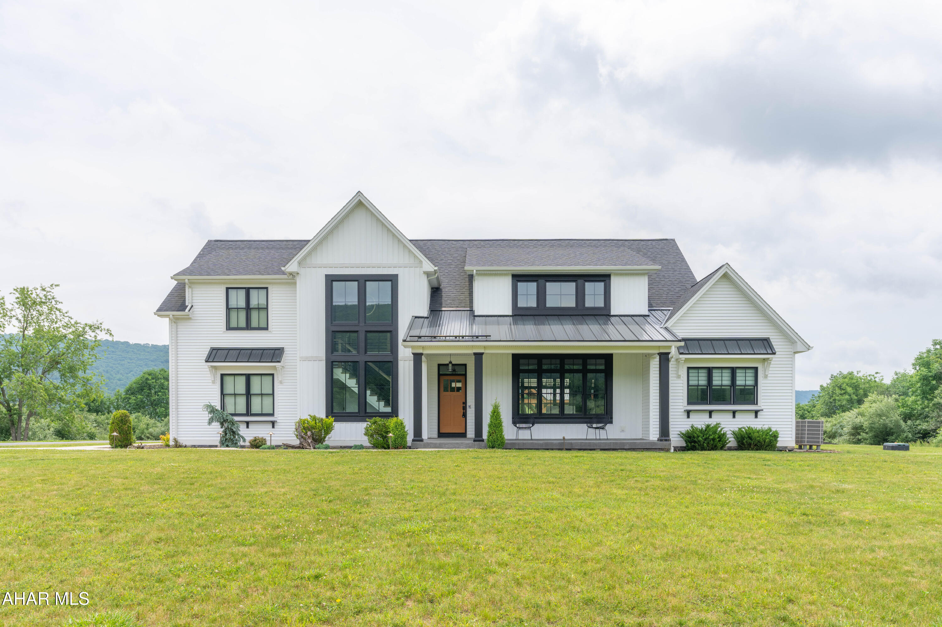 Experience refined country living in this exquisite 5-bedroom, 3 full bath custom home nestled on 6 plus acres with extraordinary mountain views. Designed with entertaining in mind, the open concept floor plan showcases beautiful custom hardwood floors and spacious living areas filled with natural light. The basement includes a cozy family room with bar, home gym, half bath and loads of storage. Outdoors, enjoy a private oasis featuring a heated in-ground, pool with an electronic safety cover, a hot tub, outdoor fireplace under a large pavilion and a Bose outdoor system creating the perfect setting for relaxation and gatherings. This extraordinary property offers the ideal blend of elegance, comfort and privacy.

Pre-Qualified Buyers Only