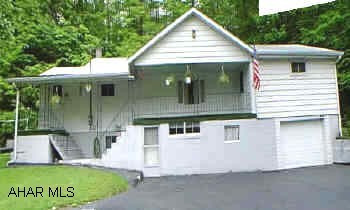 White siding W/ block 4 Br.1Bth,Lots of closet space, Lg. basement W/ pantry and freezer. White siding with block 4BR, 1 bath, lots of closet space, large basement with pantry and freezer.  This 4BR home in Hollidaysburg SD is priced to sell.  Needs new well, seller willing to pay.  Large dry basement, new refrigerator, range, washer, and hot water heater, 5 y/o furnace and 10 y/o roof.  New well to be dug.