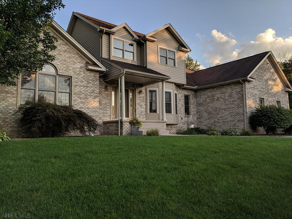 Stunning custom home built by Crossman, Castle & Morina with exceptional quality construction.  This home features 4 bedrooms and 3 baths with an open floor plan.  First floor master bedroom has double door entry with trey ceiling.  Master bath includes Jacuzzi tub, double sink vanity and large walk-in closet.  The spacious 3 car garage goes right into the laundry/mud room where you will find double closets, washer/dryer and laundry cabinets. Main floor boasts a fantastic 2 story foyer entrance that leads to the spacious kitchen.  Solid maple cabinets, prep sink in the L shaped island and a two-tiered countertop with attached bar seating adds to the beauty of this custom built kitchen!  Eat in the breakfast nook with spectacular views of the well-maintained backyard and landscaping.