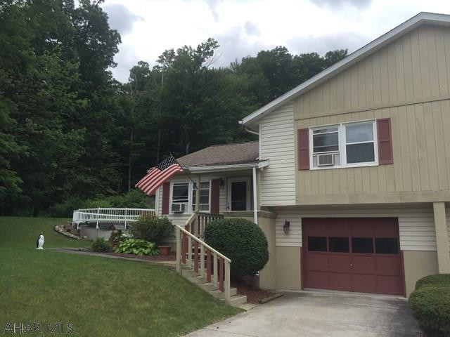 Well maintained Altoona home offers LR w/vaulted ceiling. EIK w/island & appliances, 2 spacious bedrooms & finished lower level family room. Half bath & laundry just off the integral garage. Screened rear deck, patio, and abv. ground pool all located just off Timberline Dr. next to wooded area! This home has newer windows, roof, & basement waterproofing system w/ transferable warranty