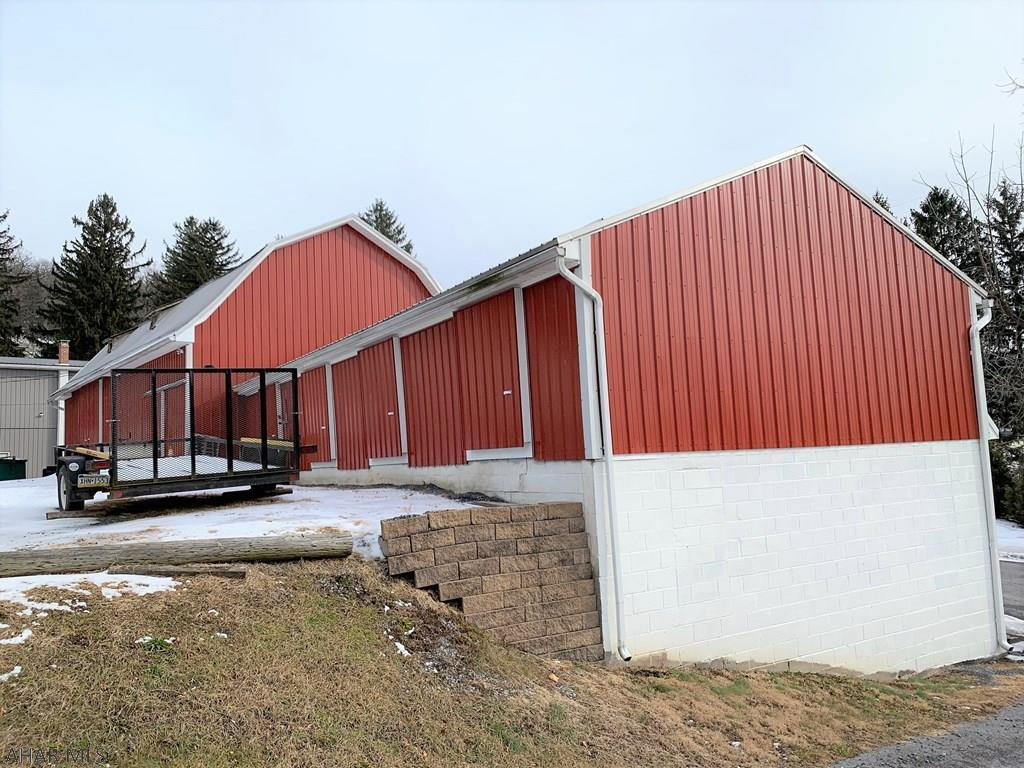 Great opportunity for investors! 1st building consists of a very large apartment that is completely updated. Full basement under offering 2-garage spaces and high ceilings (could be another rental unit). Electric is separate for apartment and garage. 1,344 S.F. w/ full basement, gas heat and CA. 2nd building is a large barn that was renovated and updated into storage units. Currently 15-units of various size plus open areas used for storage (could be converted into more individual units). There is a loading dock at the barn, large parking lot, and three phase electric on site. 3rd building is a two-story home that's rented and tenant occupied. Two additional lots that front Broad Street included in the sale. One lot is .113 of an acre and the other is .11 of an acre.