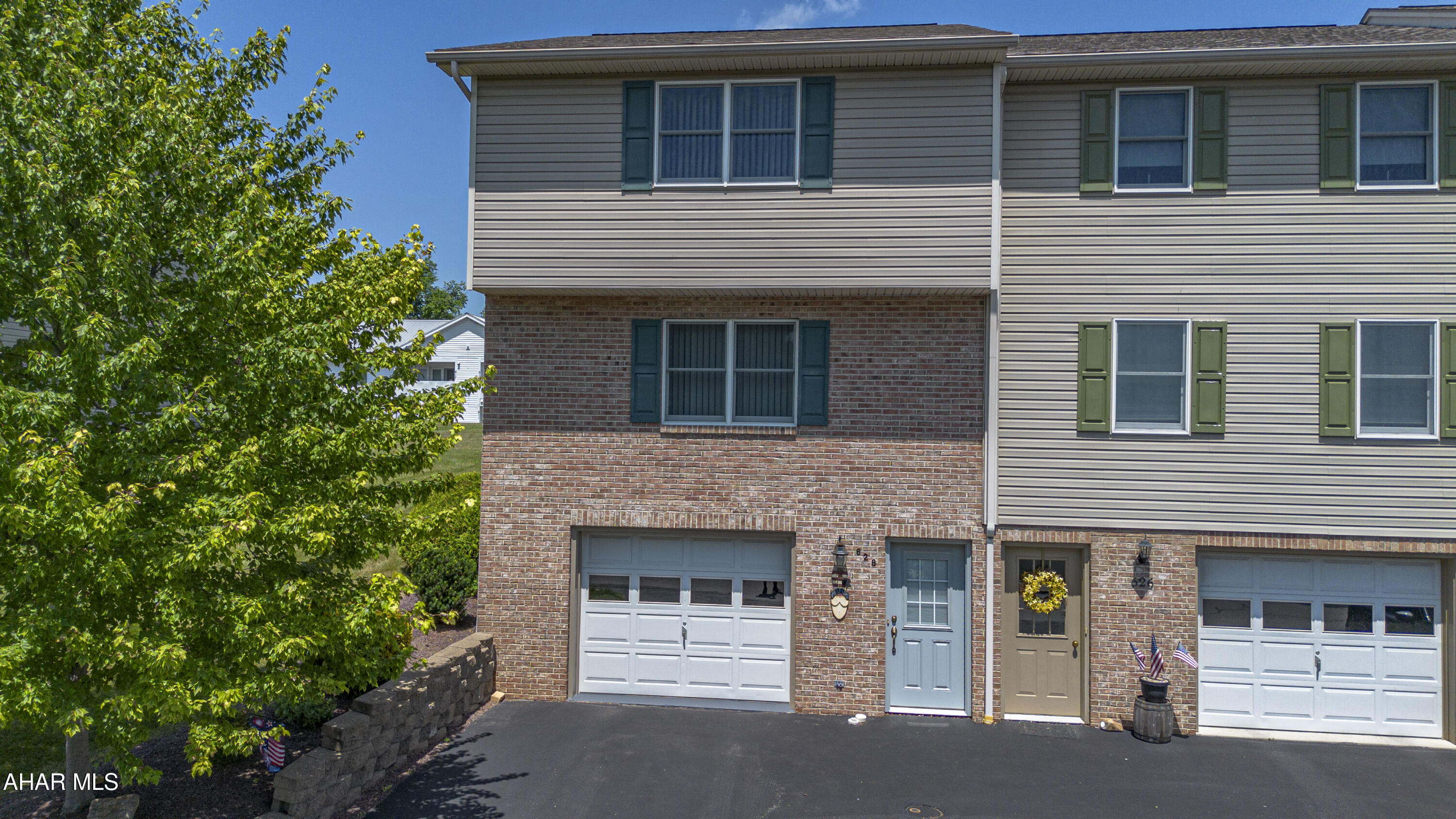 Welcome to 628 Orchard Drive in the desirable Penn Farms community! This well-maintained end-unit townhouse offers the perfect combination of space, convenience, and low-maintenance living--with no HOA fees. The bright, updated kitchen features stainless steel appliances, abundant cabinetry, and a new sliding patio door leading to a spacious deck and backyard, perfect for relaxing or entertaining.

The main level boasts generously sized living and dining areas, while upstairs you'll find two spacious bedrooms connected by a convenient Jack-and-Jill bath. The lower level includes an integral garage plus a versatile bonus room ideal for a home office, family room, gym, or guest space.

Additional highlights include extra off-street parking in the rear, natural gas heat, central air, and an attractive end-unit location offering added privacy and outdoor space. Conveniently located close to shopping, restaurants, and schools, this move-in-ready home is listed at $230,000 and is an excellent opportunity for comfortable, low-maintenance living without monthly HOA fees.