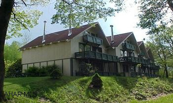 Furnished 1 bedroom condo with washer, dryer, woodstove, ceramic tile floor in kitchen, golf, indoor and outdoor swimming, and tennis courts.#  J-871  Greenfield Twp. Furnished 1 bedroom condo with washer, dryer, woodstove, ceramic tile floor in kitchen, golf, indoor and outdoor swimming, and tennis courts.  #J-871  Greenfield twp.