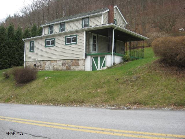 This home comes with 58.40 acres of mountain ground that's been recently surveyed.  Windows, furnace and roof were newly installed in 2005.  This home is small with lower ceilings on the porch and second floor but would make a great weekend getaway or hunting retreat.